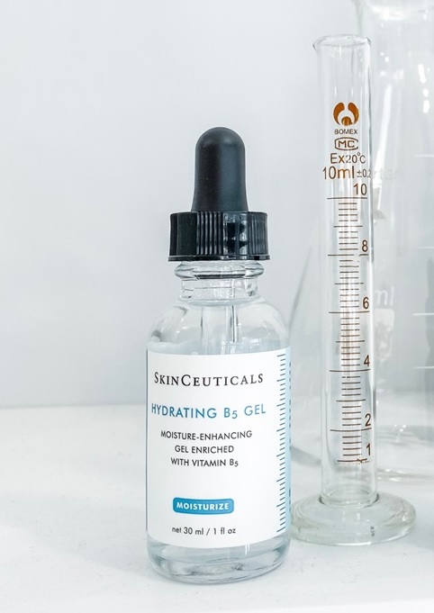 a bottle of gel next to a measuring device