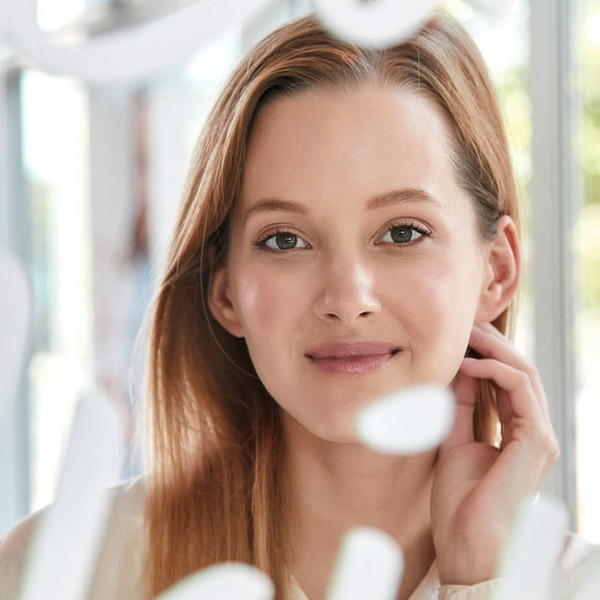 woman smiling in mirror